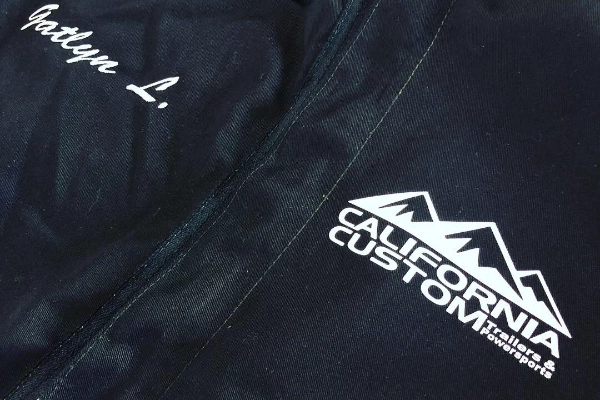 Black California Custom Trailers & Powersports jacket with embroidered name