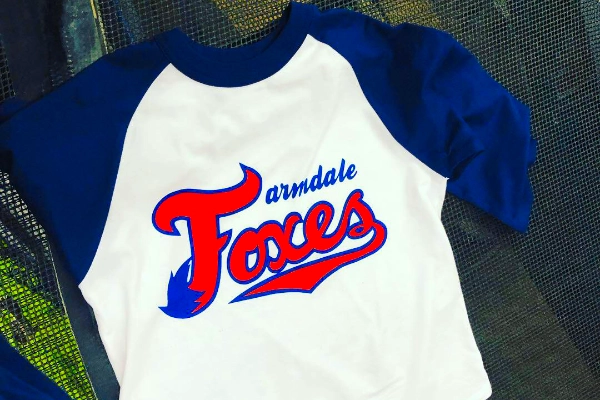 Blue and white Palmdale Foxes raglan sleeve tee with screen-printed team logo
